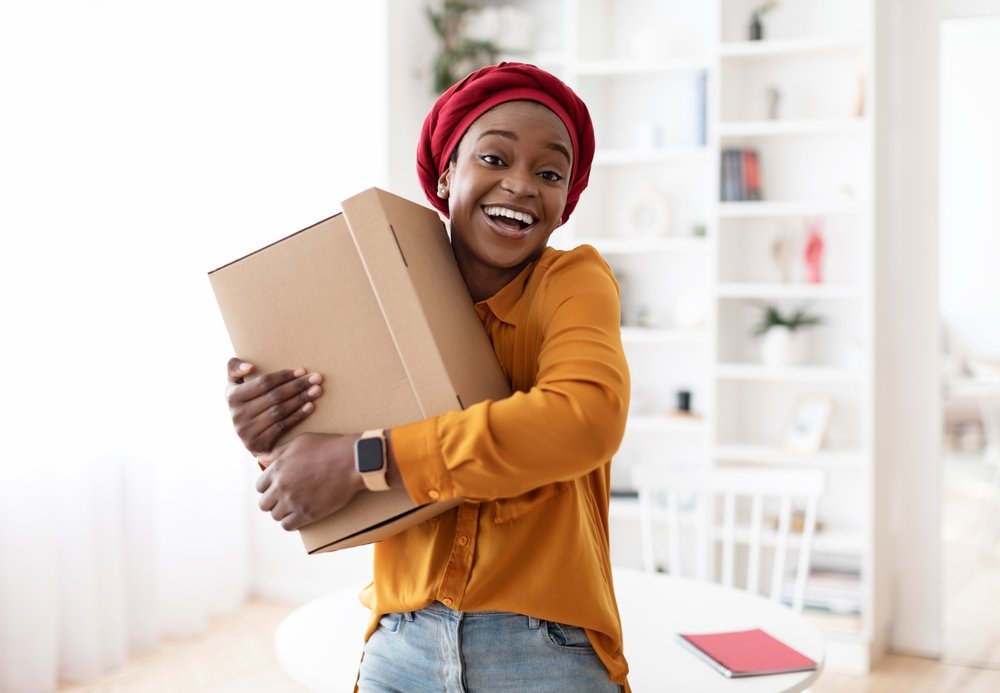 Happy customer hugging her JMova delivery